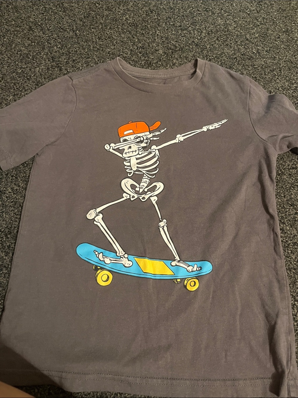 wonder nation Gray Tee with Skeleton on Blue Skateboard and Orange Cap